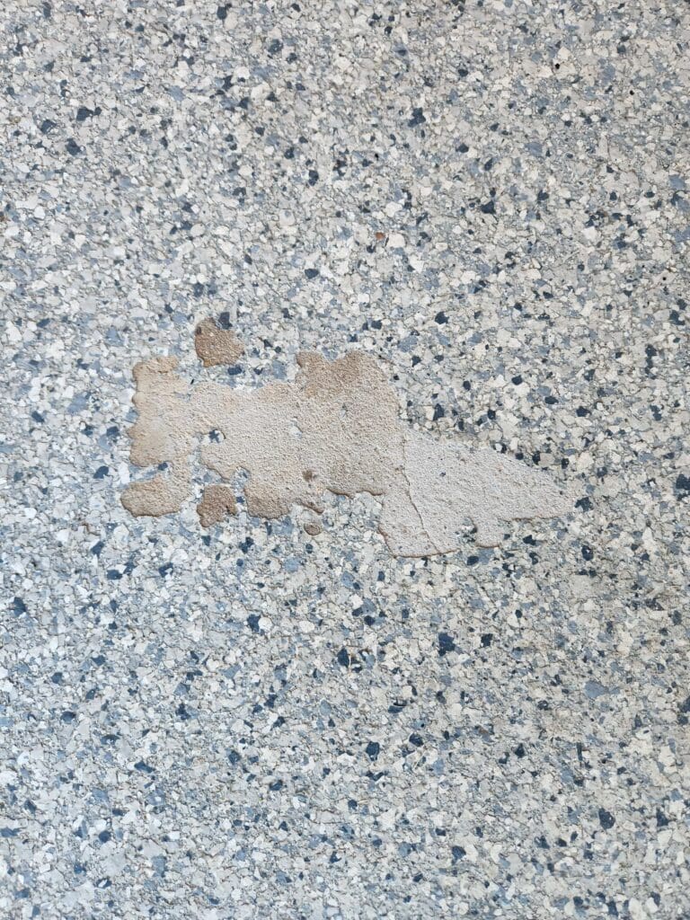 epoxy was not bonded to the concrete and peeled off.
