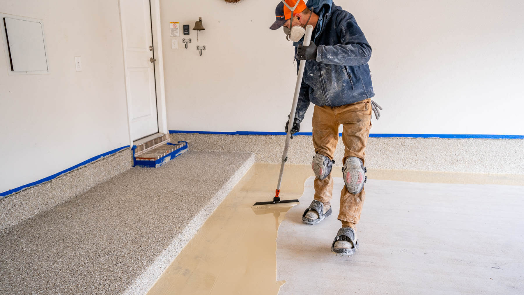 MyGarageFloors.com in-house crews applying base coating of polyaspartic floor coating