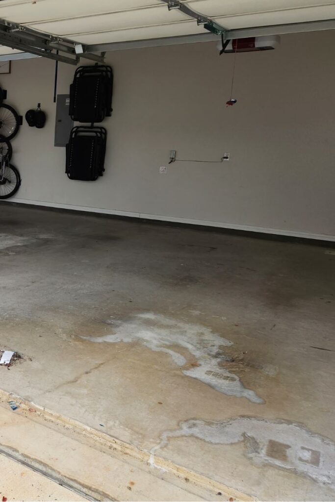 Concrete garage floor with visible coolant stains, demonstrating the need for proper cleaning techniques.