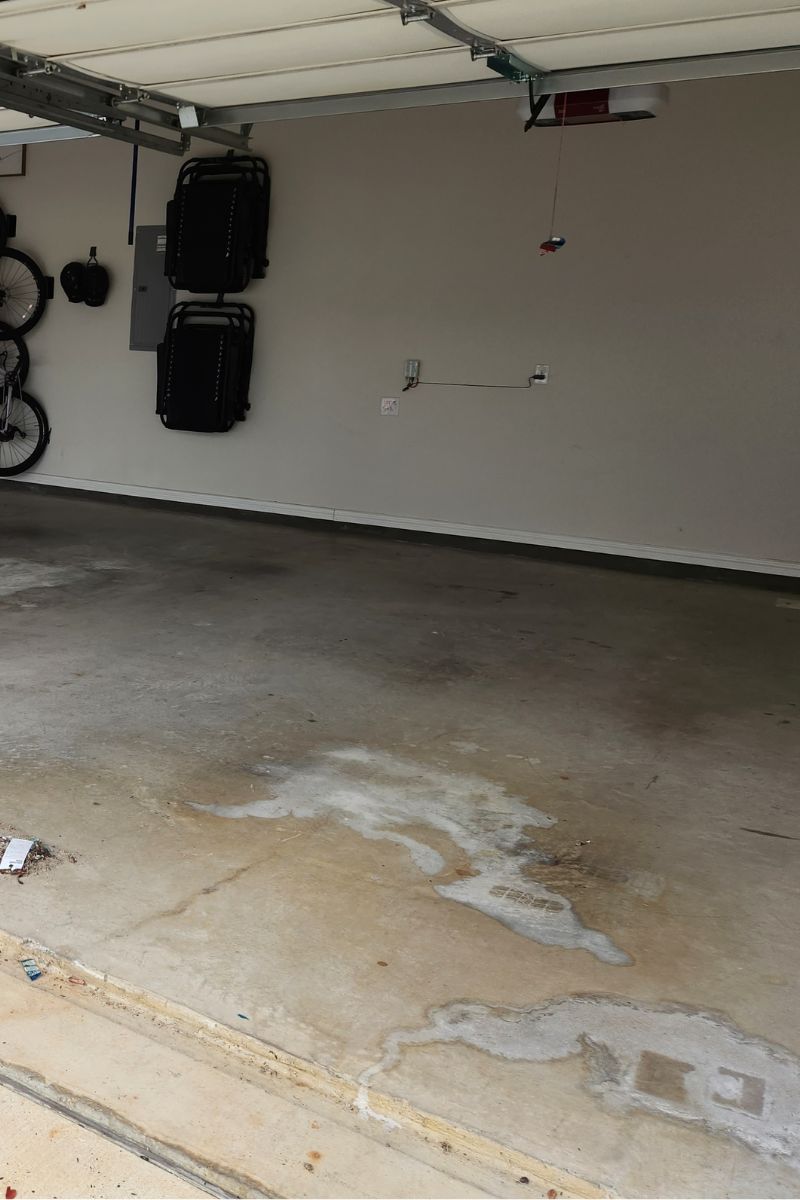 Concrete Garage Floor with Visible Coolant Stains, Demonstrating the Need for Proper Cleaning Techniques. - How to Clean Coolant Stains from Concrete: Easy Step-by-step Guide - How to Clean Coolant Stains from Concrete: Easy Step-by-step Guide