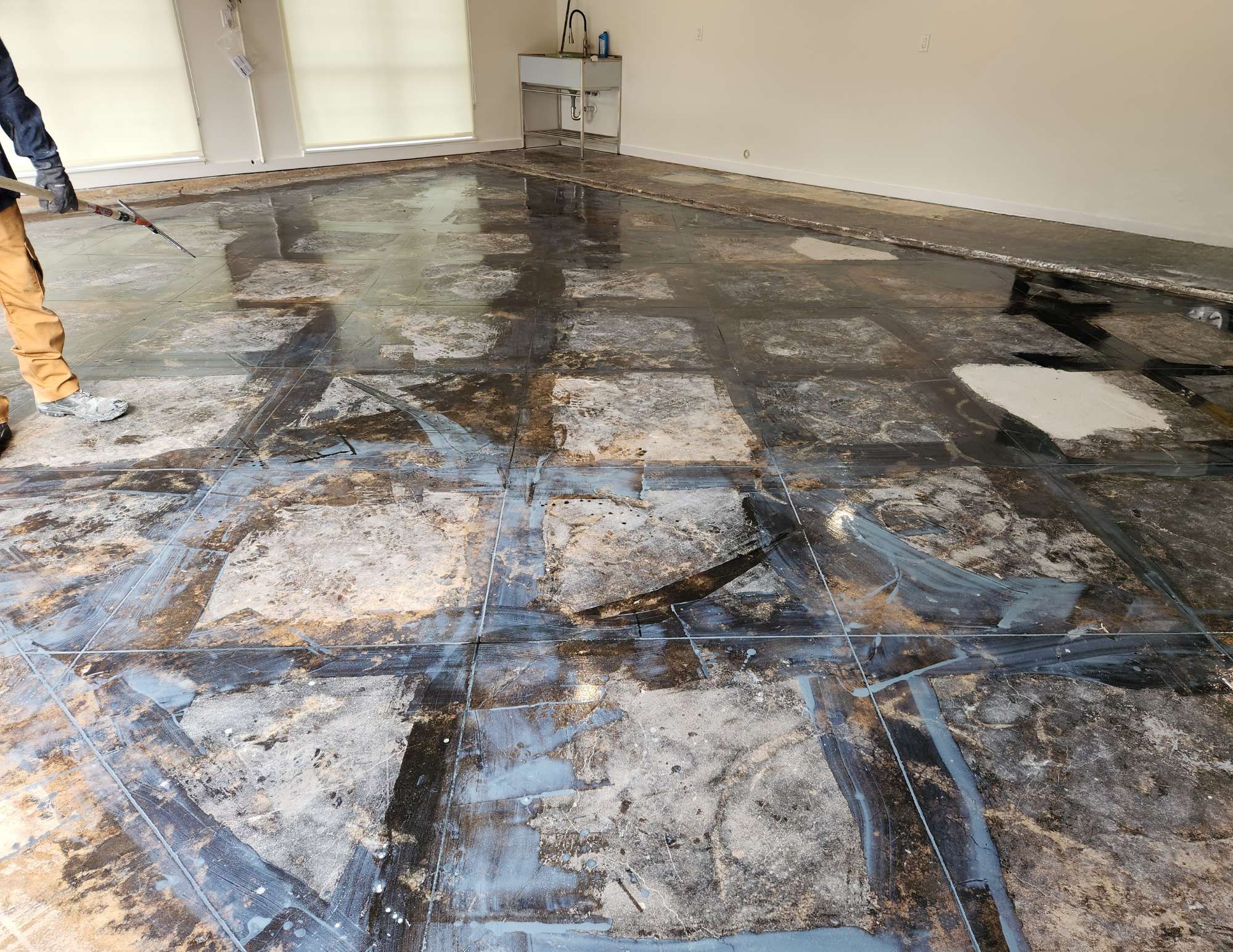 a Garage Floor Undergoing Preparation Before Applying a Polyaspartic Coating, Showing the Cleaned and Repaired Surface. - Preparing a Garage Floor for Coating