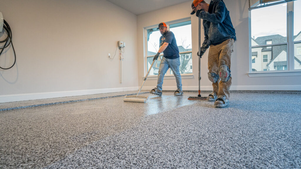 A finished polyaspartic flake garage floor, photographed from inside the garage