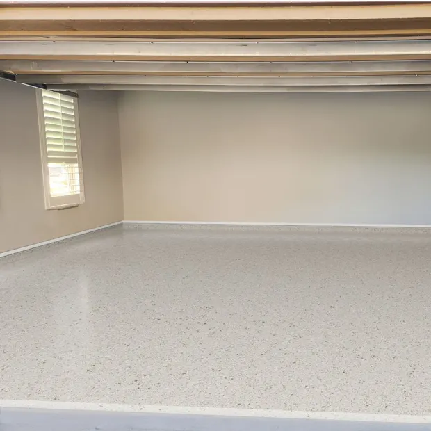 Sandstone cream and tan full flake polyaspartic garage floor coating by MyGarageFloors.com
