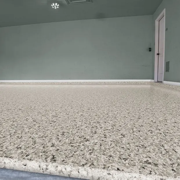 Snowfall white and tan full flake polyaspartic garage floor coating by MyGarageFloors.com